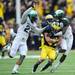 Michigan wide receiver Drew Dileo protects the ball as he is brought down by Michigan Kurtis Drummond and Darqueze Dennard during the second quarter at Michigan Stadium on Saturday afternoon. Melanie Maxwell I AnnArbor.com